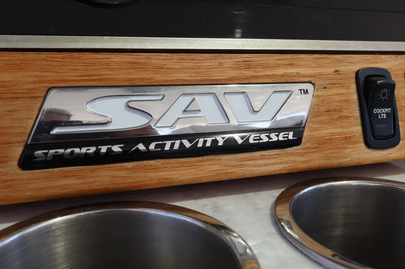  Yacht Photos Pics 2022 Regal 38 SAV Sports Activity Vessel emblem with cockpit lights switch.