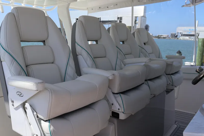  Yacht Photos Pics Luxury seating on 2022 Regal 38 SAV boat, featuring plush white leather chairs.