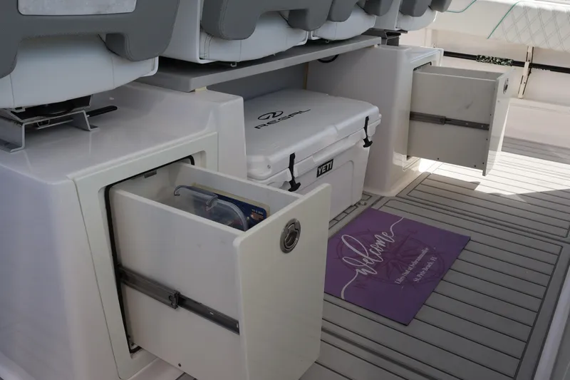  Yacht Photos Pics 2022 Regal 38 SAV boat interior with storage drawers and YETI cooler.