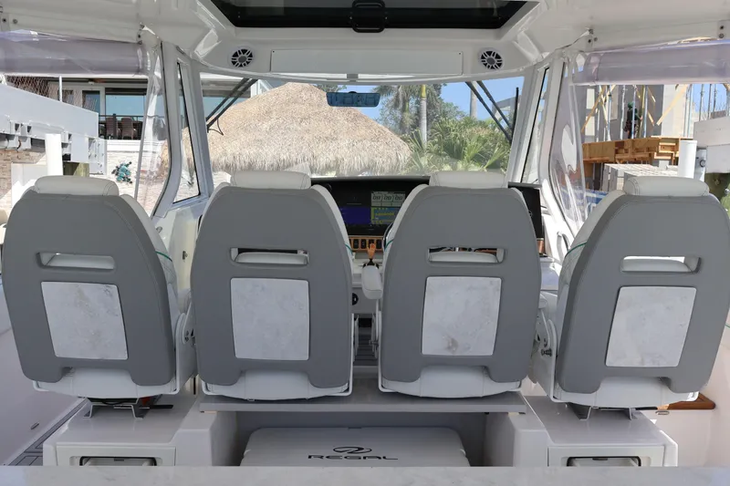  Yacht Photos Pics 2022 Regal 38 SAV boat interior with three modern helm seats.