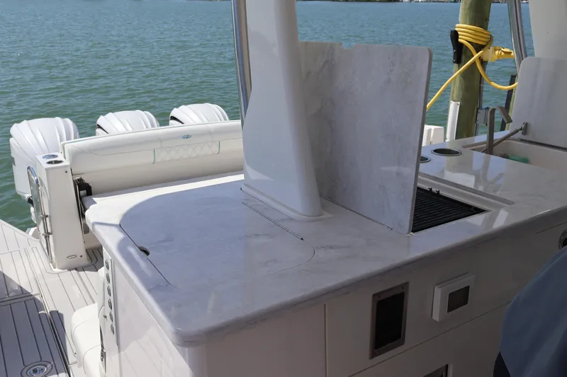  Yacht Photos Pics 2022 Regal 38 SAV boat with sleek outdoor kitchen and powerful engines.