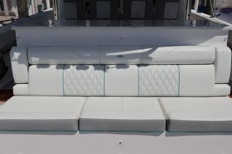  Yacht Photos Pics Luxurious seating on 2022 Regal 38 SAV boat with quilted white upholstery.