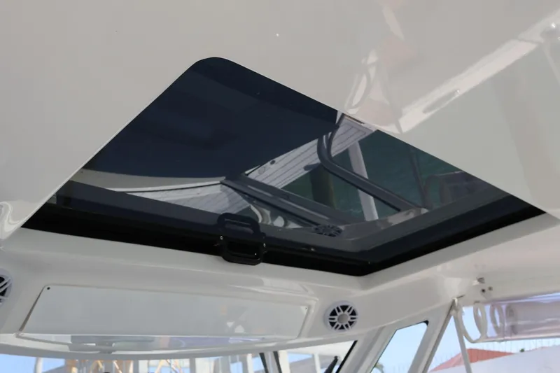  Yacht Photos Pics 2022 Regal 38 SAV boat interior with open sunroof and sleek design.