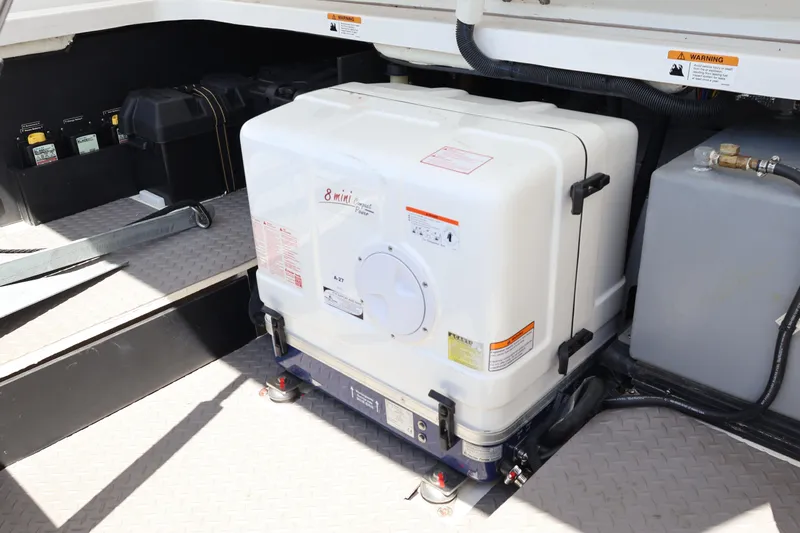  Yacht Photos Pics 2022 Regal 38 SAV engine compartment with generator and battery setup.