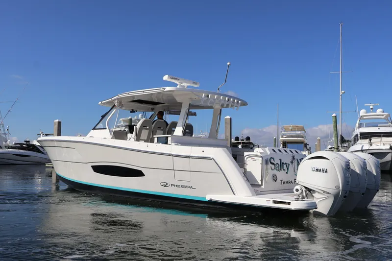  Yacht Photos Pics 2022 Regal 38 SAV boat docked, featuring Yamaha engines and sleek design.