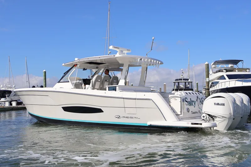  Yacht Photos Pics 2022 Regal 38 SAV boat with Yamaha engines docked in marina.