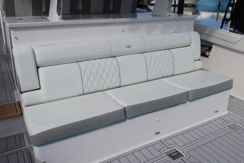  Yacht Photos Pics 2022 Regal 38 SAV boat interior with elegant white seating and diamond stitching.
