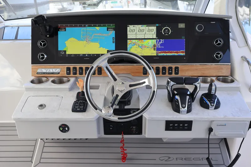  Yacht Photos Pics 2022 Regal 38 SAV boat dashboard with navigation screens and controls.