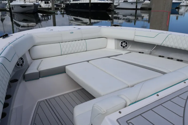  Yacht Photos Pics Luxurious seating area on 2022 Regal 38 SAV boat, docked at marina.