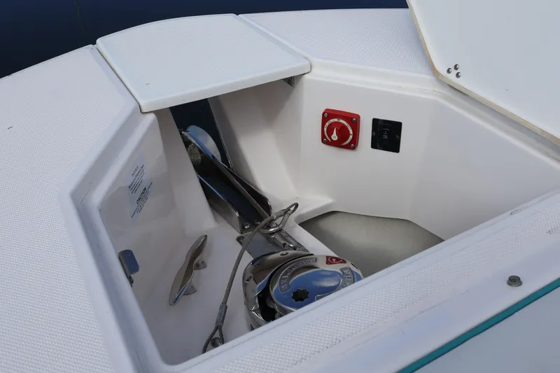  Yacht Photos Pics 2022 Regal 38 SAV boat anchor compartment with control panel and storage.