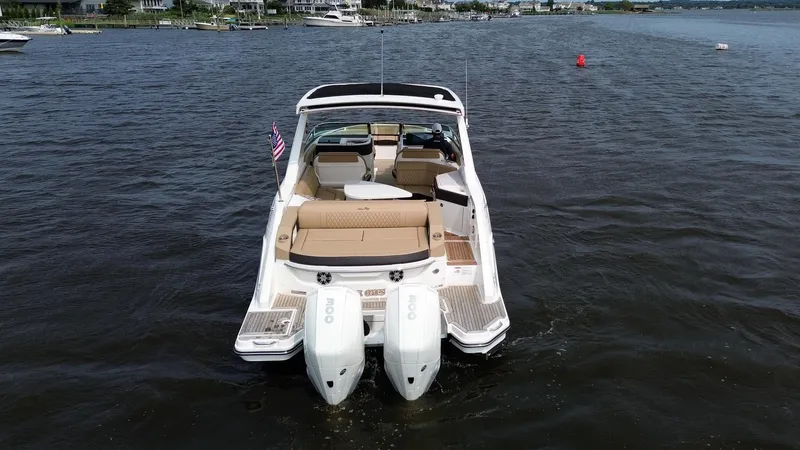  Yacht Photos Pics 2023 Sea Ray SLX 310 boat on water, rear view with twin engines.