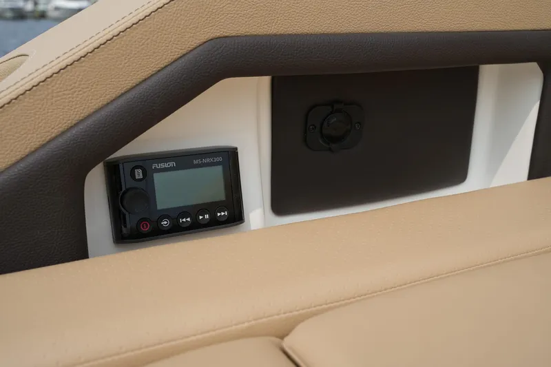  Yacht Photos Pics 2023 Sea Ray SLX 310 interior with Fusion stereo system and beige upholstery.