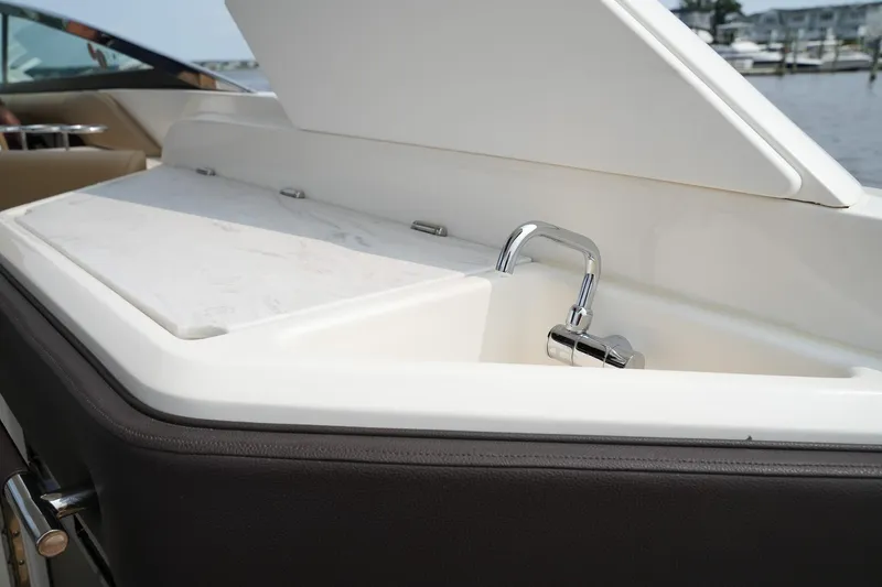  Yacht Photos Pics 2023 Sea Ray SLX 310 boat sink with open lid, dockside view.