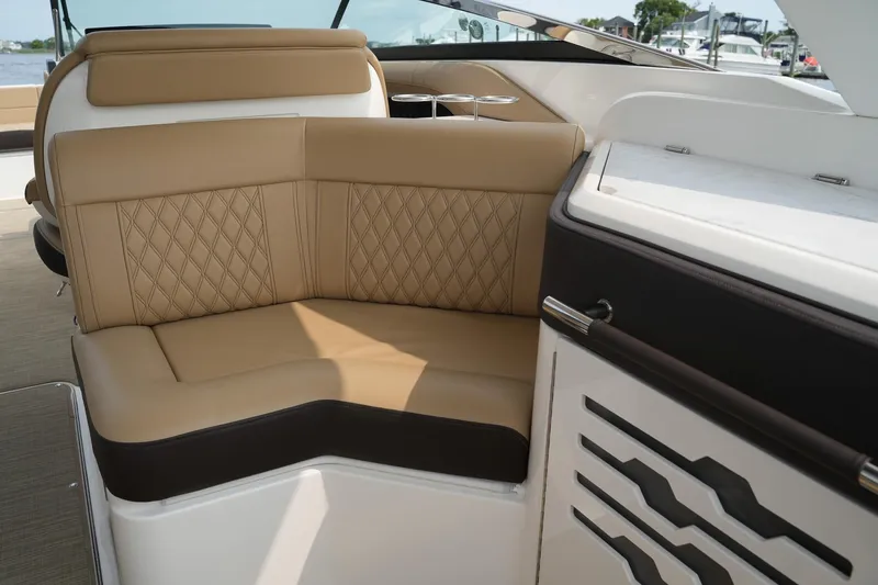  Yacht Photos Pics 2023 Sea Ray SLX 310 boat interior with tan leather seating and modern design.