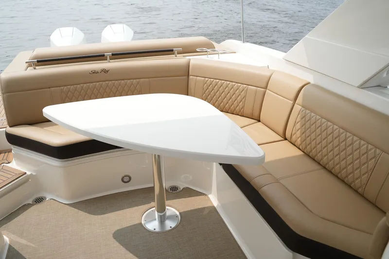 Yacht Photos Pics Luxurious seating area on 2023 Sea Ray SLX 310 boat with elegant table.