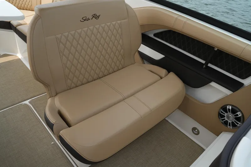  Yacht Photos Pics Luxurious seating on 2023 Sea Ray SLX 310 boat with beige upholstery and diamond stitching.