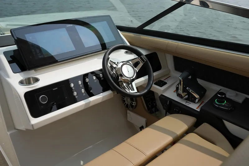  Yacht Photos Pics 2023 Sea Ray SLX 310 helm with modern controls and sleek design.