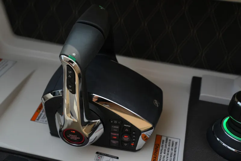  Yacht Photos Pics Throttle control of 2023 Sea Ray SLX 310 boat, featuring sleek design and advanced controls.