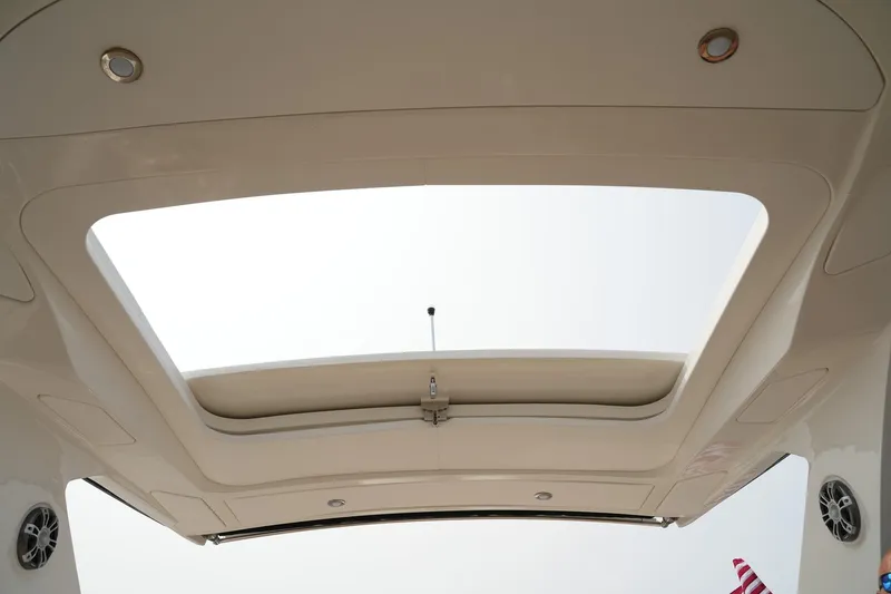  Yacht Photos Pics 2023 Sea Ray SLX 310 boat sunroof view with speakers and lighting.