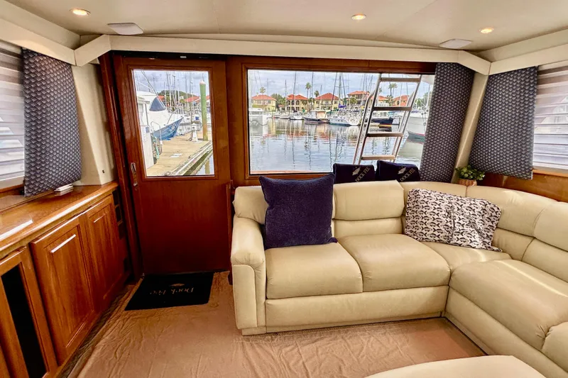 Dock Fee Yacht Photos Pics Luxurious interior of 1998 Viking 50 Convertible yacht with marina view.