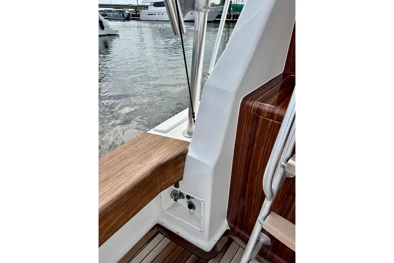 Dock Fee Yacht Photos Pics 1998 Viking 50 Convertible yacht detail with wood accents and marina background.