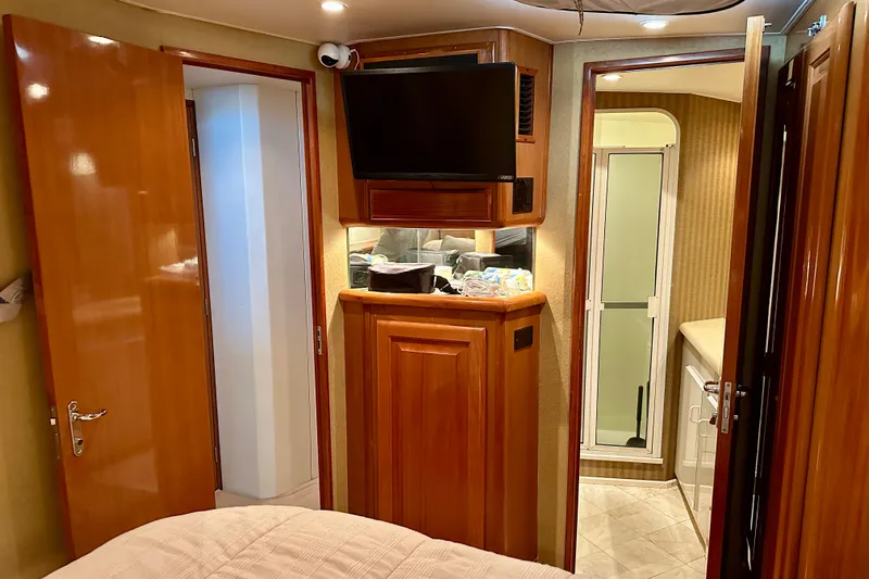 Dock Fee Yacht Photos Pics Interior of 1998 Viking 50 Convertible yacht with wood paneling and modern amenities.