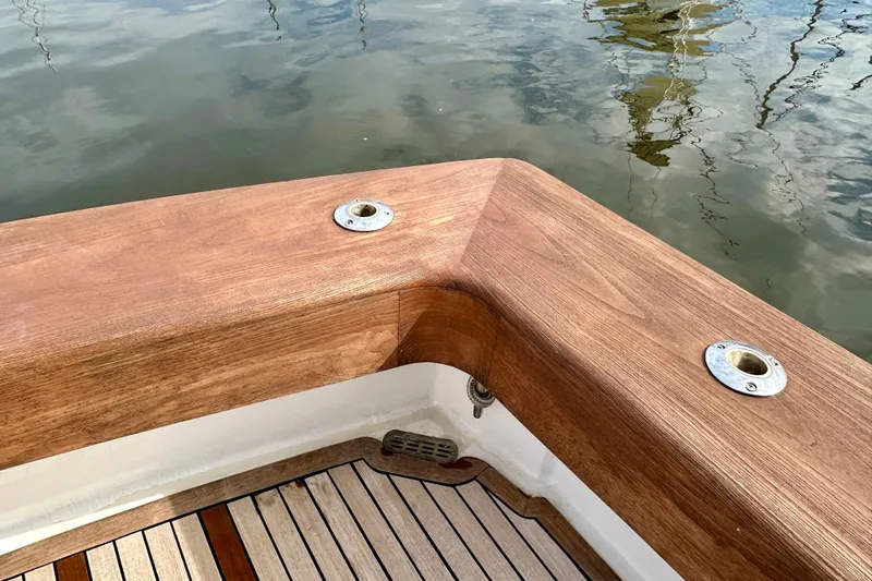 Dock Fee Yacht Photos Pics Wooden deck detail of 1998 Viking 50 Convertible boat by the water.