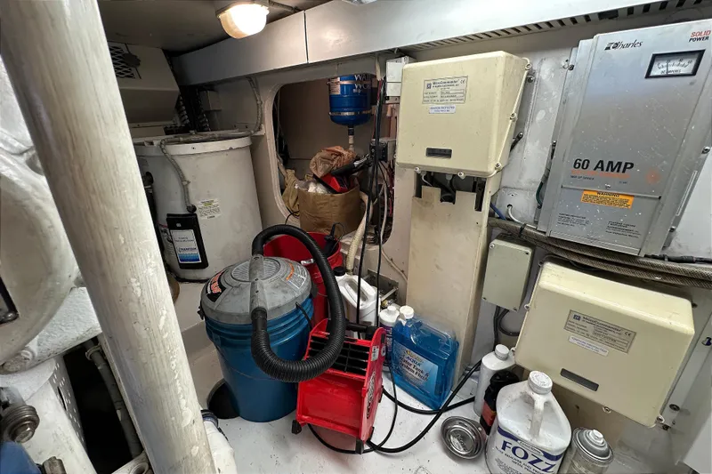 Dock Fee Yacht Photos Pics Engine room of 1998 Viking 50 Convertible with equipment and cleaning supplies.