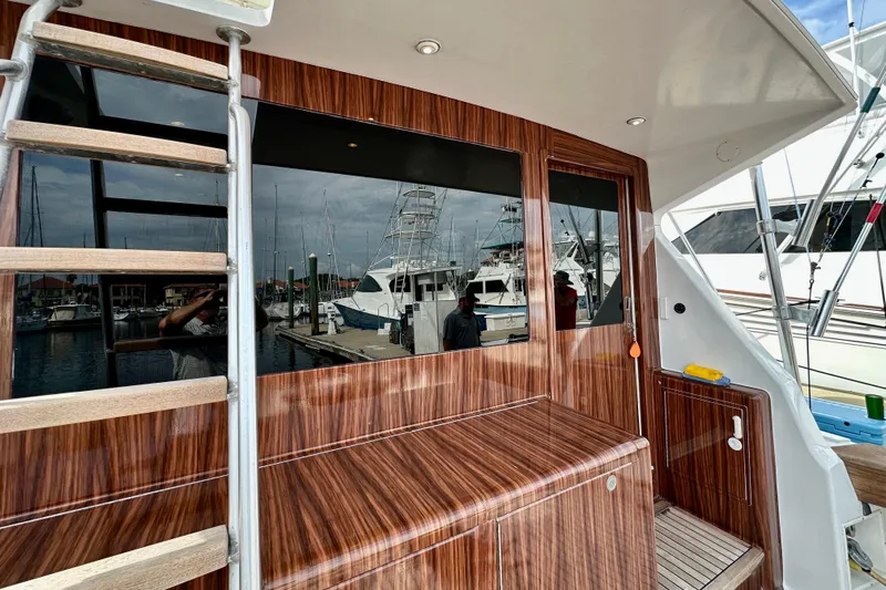 Dock Fee Yacht Photos Pics 1998 Viking 50 Convertible yacht with wood finish and marina view.