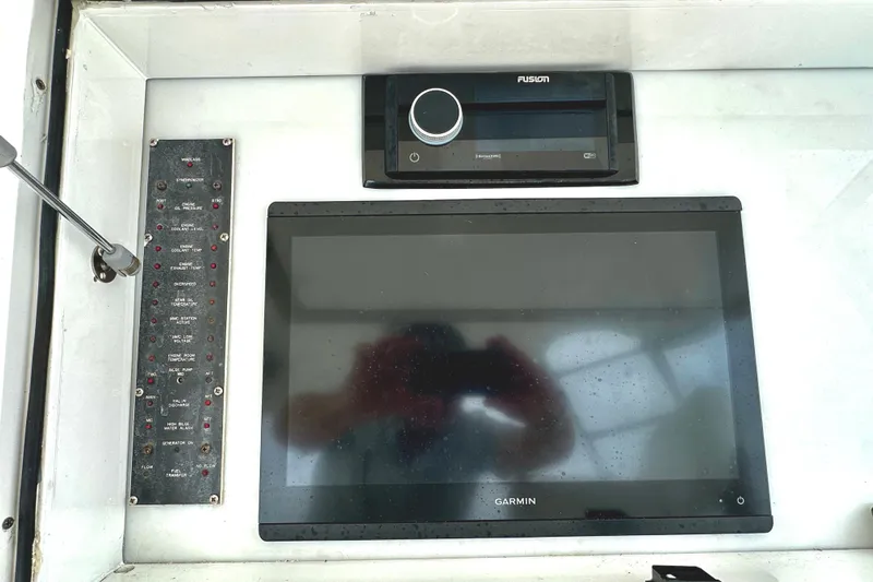 Dock Fee Yacht Photos Pics Control panel of a 1998 Viking 50 Convertible with Garmin and Fusion electronics.
