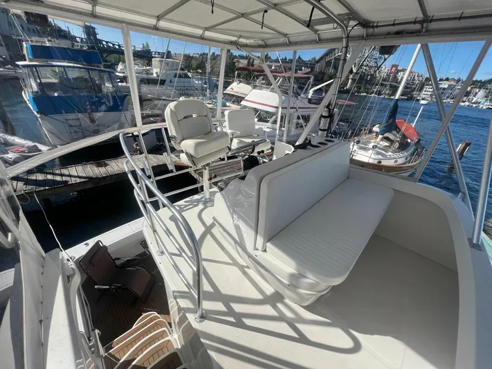 Uno Mas Yacht Photos Pics 2001 Luhrs 360 Convertible yacht interior with seating, docked at marina.