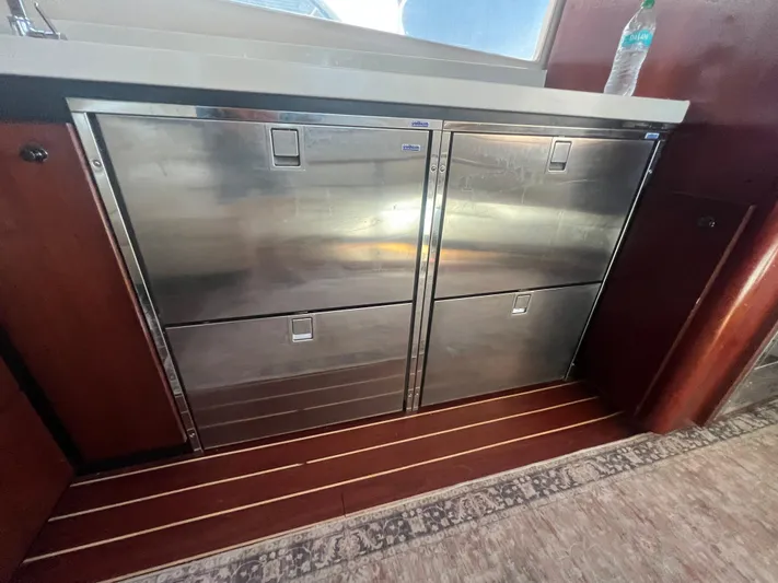 Uno Mas Yacht Photos Pics Stainless steel cabinets on 2001 Luhrs 360 Convertible yacht interior.