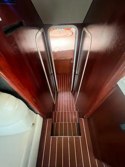 Uno Mas Yacht Photos Pics Interior view of 2001 Luhrs 360 Convertible yacht with wooden flooring and cozy cabin.