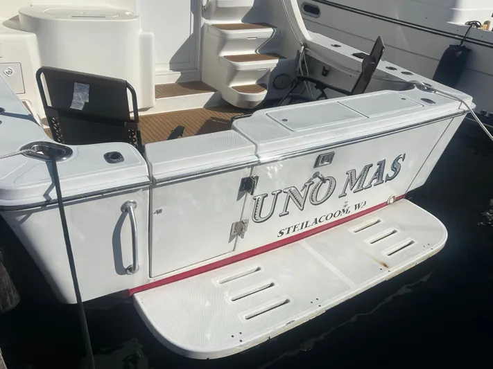Uno Mas Yacht Photos Pics 2001 Luhrs 360 Convertible boat stern with "UNO MAS" name, docked in Steilacoom, WA.