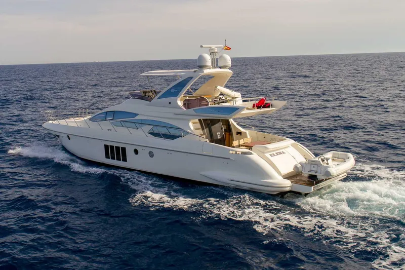 Elena Yacht Photos Pics Luxurious 2013 Azimut 64 yacht cruising on open sea under clear skies.