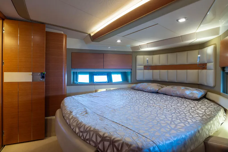 Elena Yacht Photos Pics Luxurious bedroom interior of 2013 Azimut 64 yacht with modern design and ambient lighting.