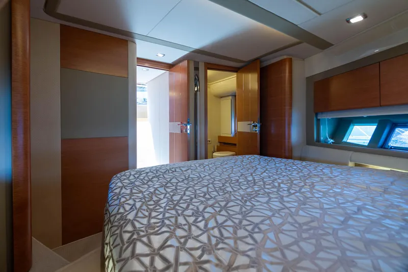 Elena Yacht Photos Pics Luxurious bedroom interior of 2013 Azimut 64 yacht with modern design and natural light.
