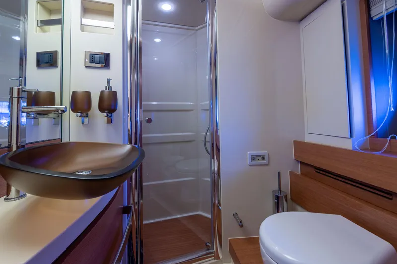 Elena Yacht Photos Pics Luxurious bathroom in 2013 Azimut 64 yacht with modern fixtures and elegant design.