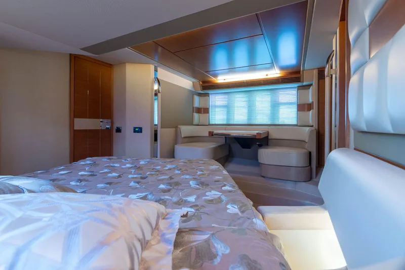 Elena Yacht Photos Pics Luxurious interior of a 2013 Azimut 64 yacht with elegant bedding and seating area.