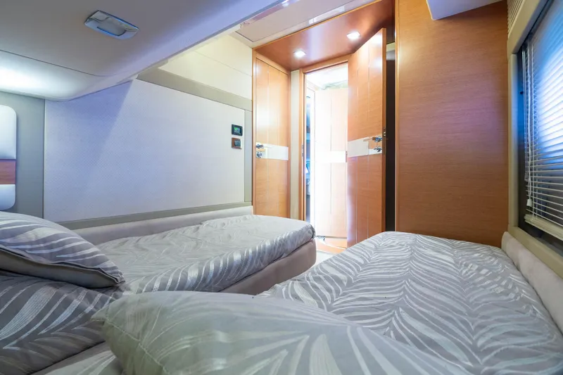 Elena Yacht Photos Pics Interior of 2013 Azimut 64 yacht with twin beds and modern decor.