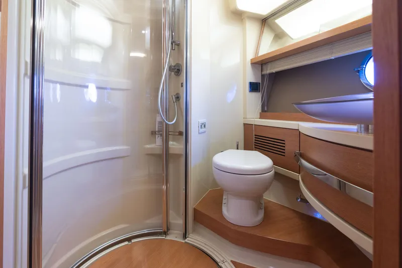 Elena Yacht Photos Pics Luxurious bathroom in 2013 Azimut 64 yacht with modern fixtures and elegant design.