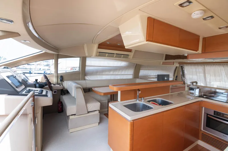 Elena Yacht Photos Pics Luxurious interior of 2013 Azimut 64 yacht with modern kitchen and seating area.