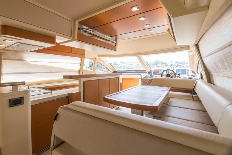 Elena Yacht Photos Pics Luxurious interior of a 2013 Azimut 64 yacht with elegant seating and modern design.