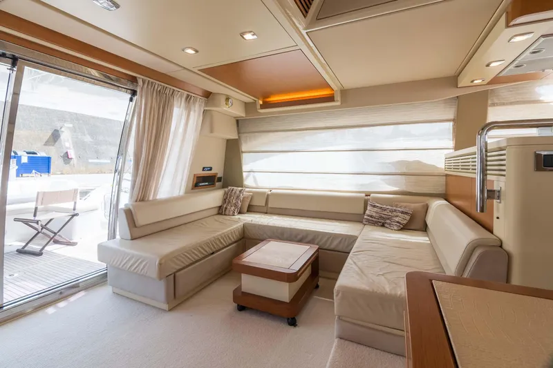 Elena Yacht Photos Pics Luxurious interior of a 2013 Azimut 64 yacht with elegant seating and modern design.