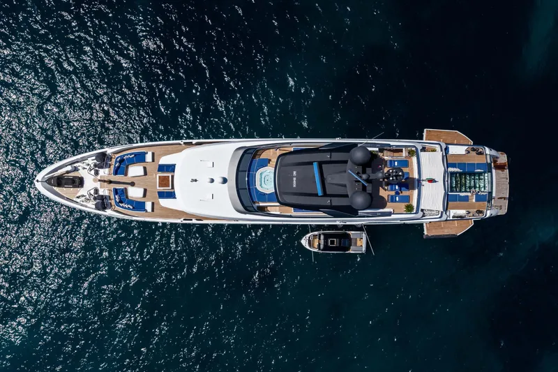  Yacht Photos Pics Aerial view of 2018 Sanlorenzo 52Steel yacht on shimmering water.