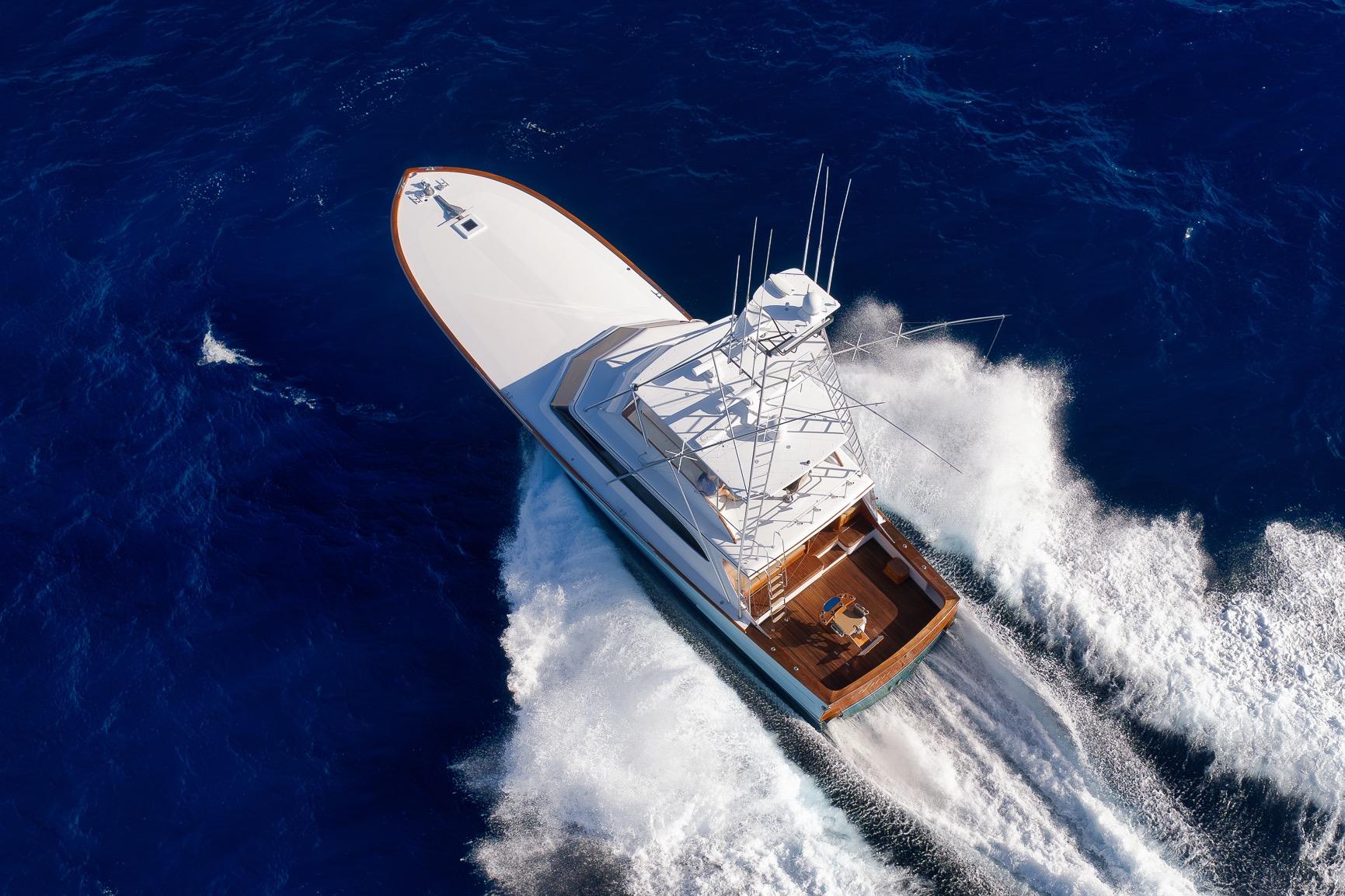 Aerial view of 1993 Merritt Sportfish yacht cruising through deep blue ocean waters.