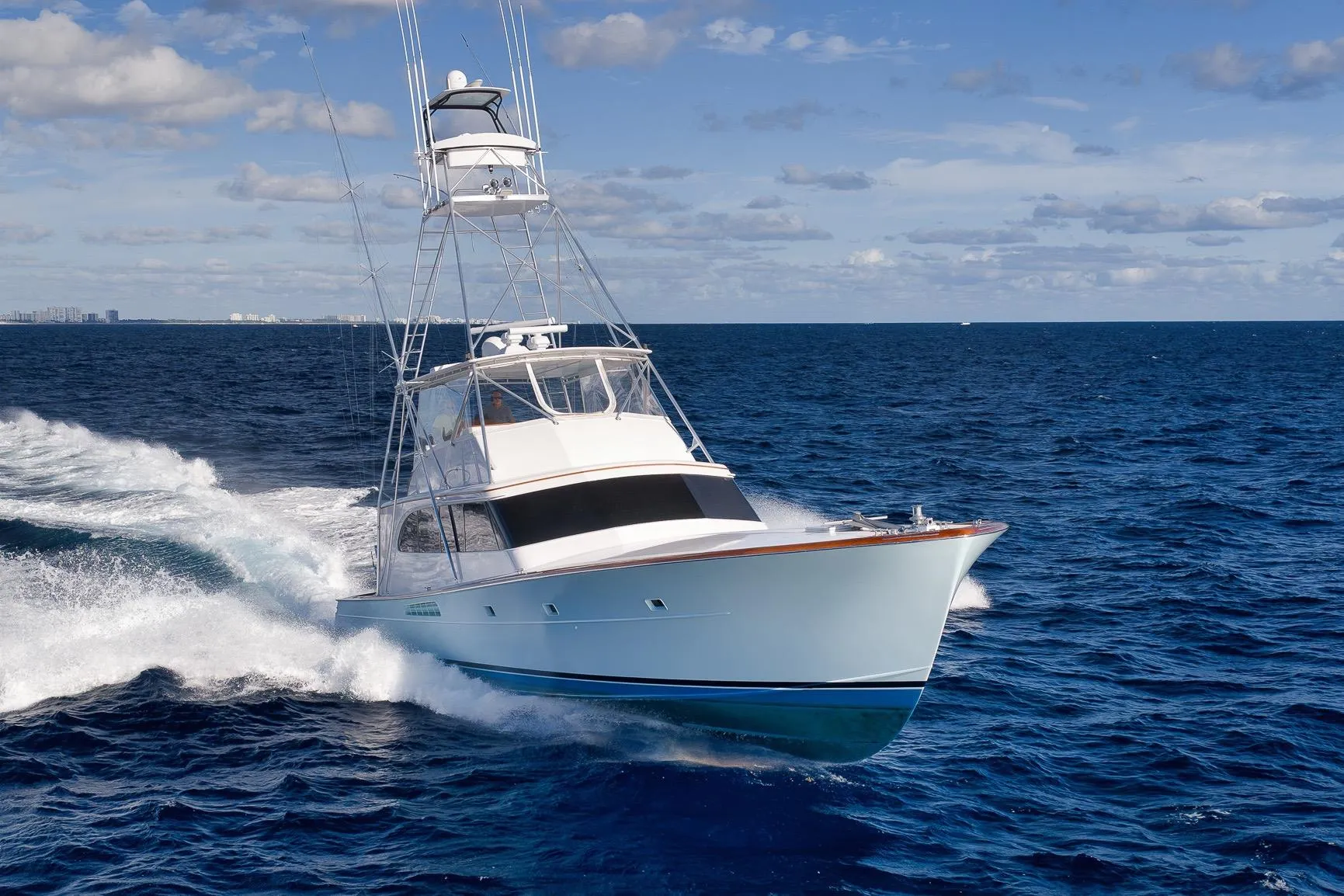 1993 Merritt Sportfish yacht cruising on open ocean under clear skies.