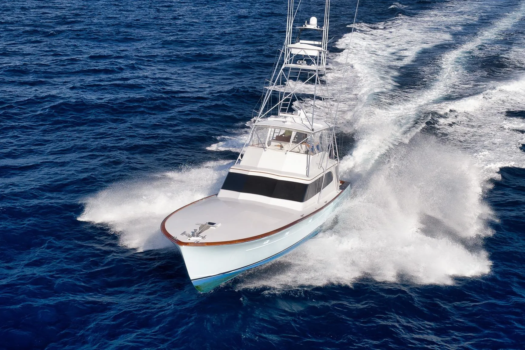 1993 Merritt Sportfish yacht cruising swiftly on open ocean waters.