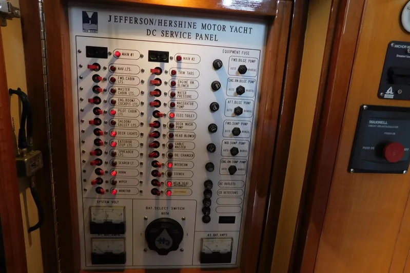 Liquid Gold Yacht Photos Pics 2001 Jefferson Pilothouse 57 yacht DC service panel with labeled switches and controls.