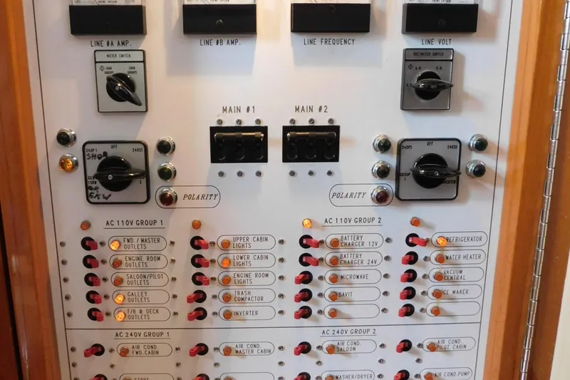Liquid Gold Yacht Photos Pics Electrical control panel of a 2001 Jefferson Pilothouse 57 yacht, showing switches and indicators.
